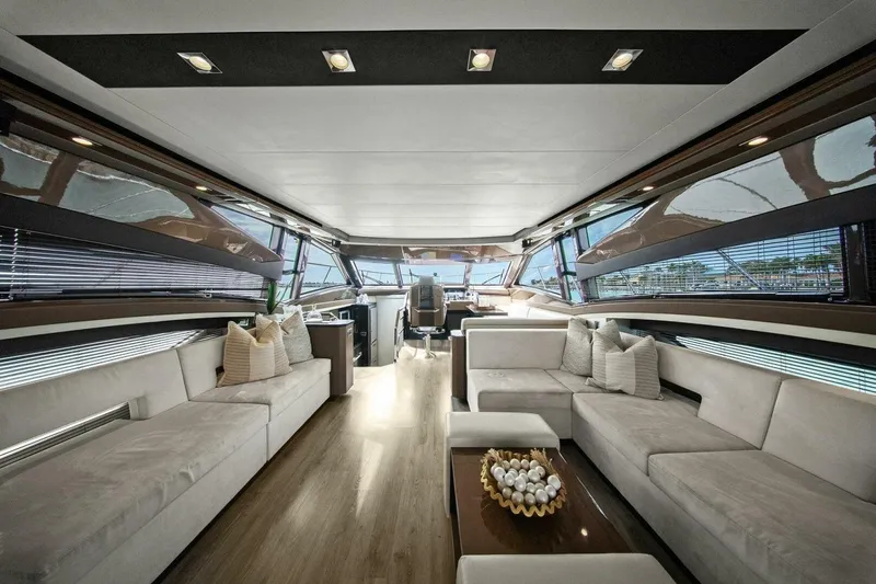 Slide: The Image of Luxurious interior of 2014 Marquis 630 Sport Yacht with modern seating and panoramic windows. - 3