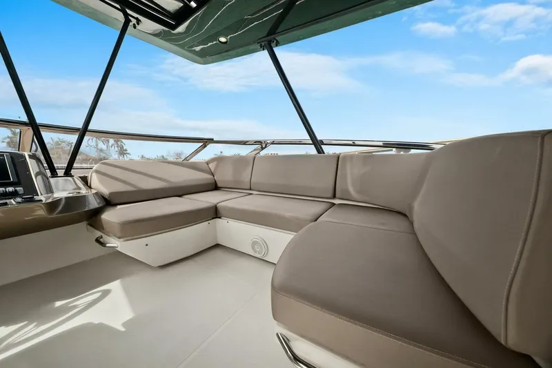 Slide: The Image of Luxurious interior of 2014 Marquis 630 Sport Yacht with spacious seating and panoramic windows. - 32