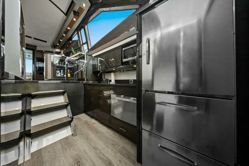 Slide: The Image of Luxurious kitchen interior of 2014 Marquis 630 Sport Yacht with modern appliances and sleek design. - 38