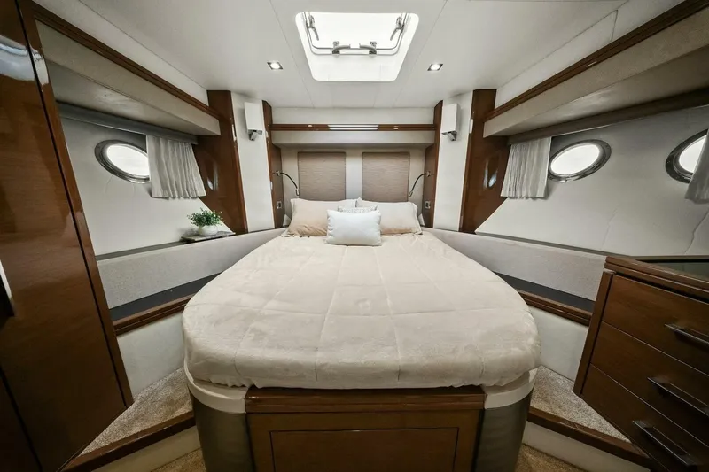 Slide: The Image of Luxurious bedroom interior of 2014 Marquis 630 Sport Yacht with elegant wood finishes. - 41