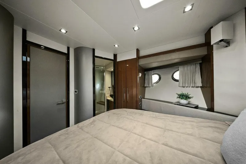 Slide: The Image of Luxurious bedroom interior of 2014 Marquis 630 Sport Yacht with modern design and porthole windows. - 43