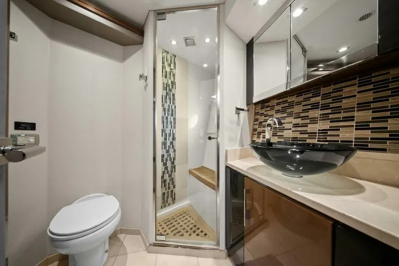 Slide: The Image of Luxurious bathroom in 2014 Marquis 630 Sport Yacht with modern fixtures and elegant design. - 44
