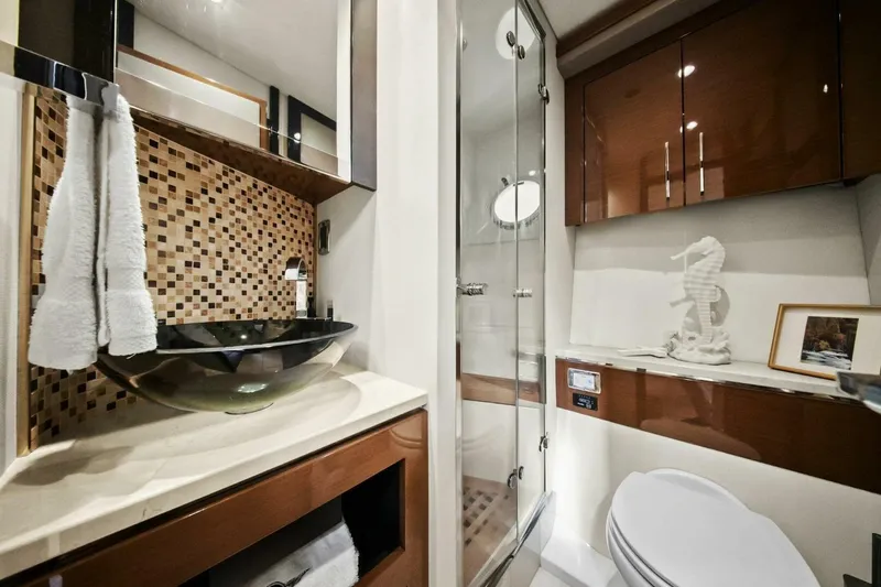 Slide: The Image of Luxurious bathroom in 2014 Marquis 630 Sport Yacht with modern fixtures and elegant decor. - 47