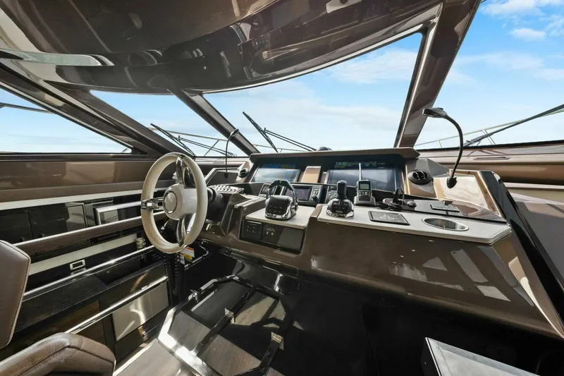 Slide: The Image of Interior cockpit of 2014 Marquis 630 Sport Yacht with modern navigation equipment. - 7
