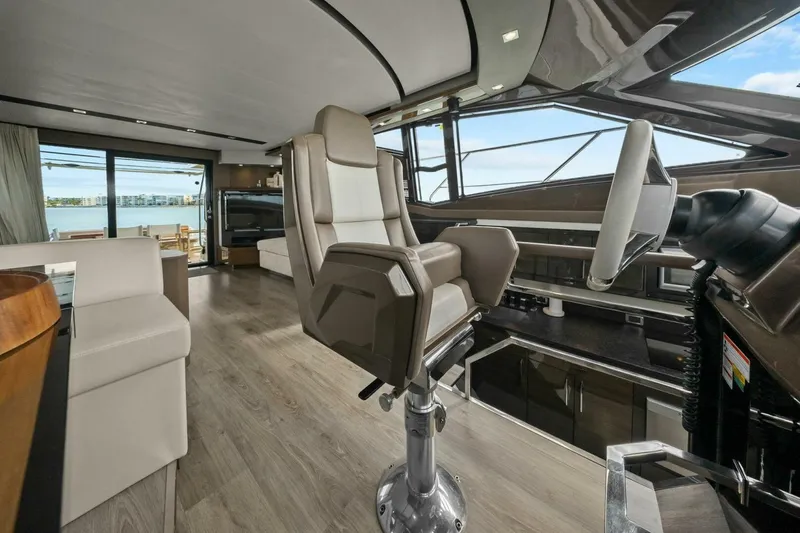 Slide: The Image of Luxurious interior of 2014 Marquis 630 Sport Yacht with modern helm and panoramic windows. - 9