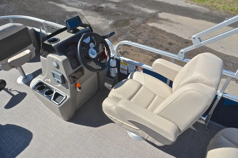 Slide: The Image of 2024 Sun Tracker Bass Buggy 18 DLX boat interior with steering console and seating. - 26