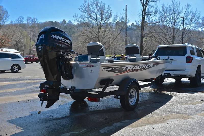 Slide: The Image of 2017 Bass Tracker Pro 16 boat with Mercury engine on trailer in parking lot. - 14