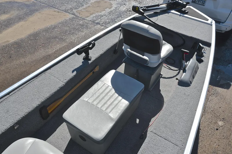 Slide: The Image of 2017 Bass Tracker Pro 16 boat interior with seating and fishing equipment. - 21