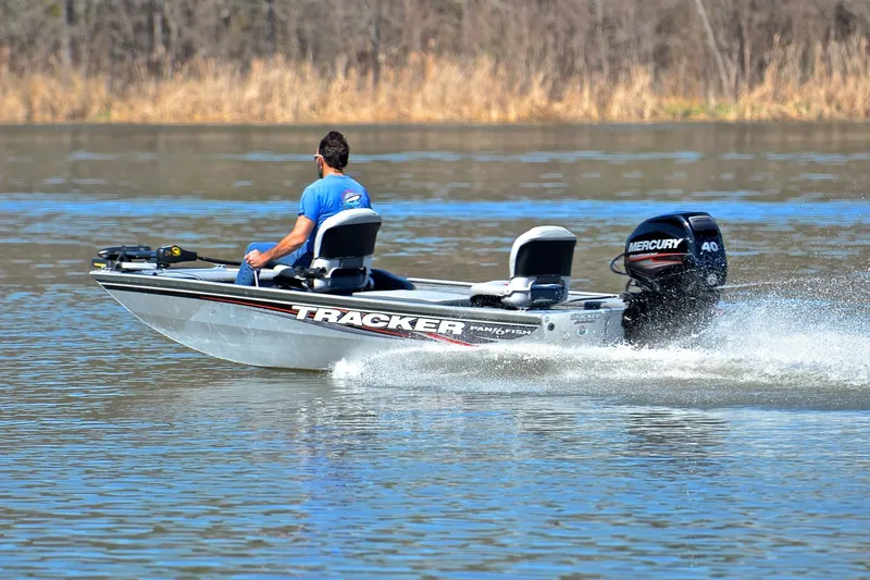 Slide: The Image of 2017 Bass Tracker Pro 16 boat speeding on a lake with Mercury engine. - 4