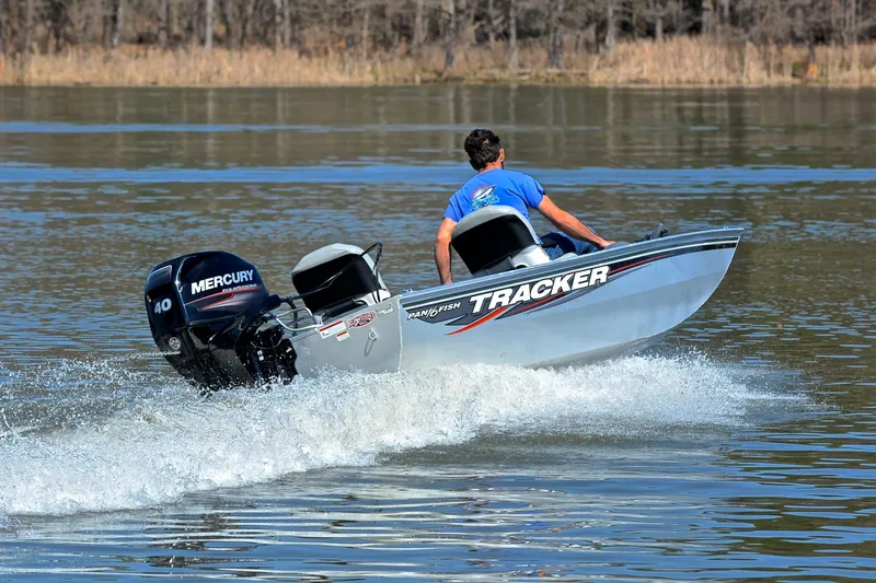 Slide: The Image of 2017 Bass Tracker Pro 16 boat with Mercury engine on a lake. - 5