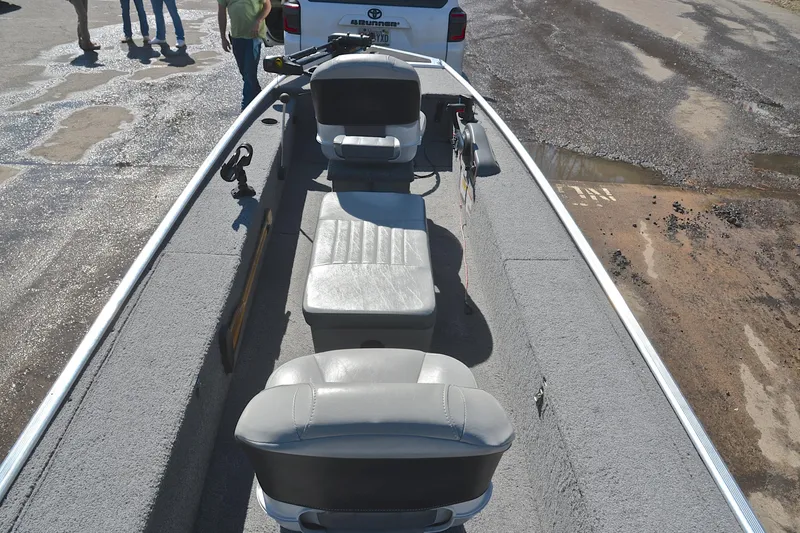 Slide: The Image of 2017 Bass Tracker Pro 16 boat interior with seating and fishing equipment. - 20