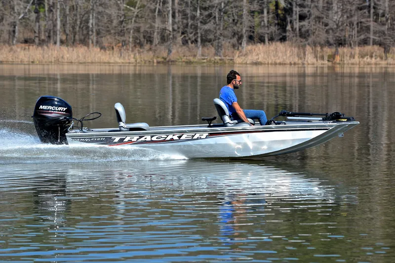Slide: The Image of 2017 Bass Tracker Pro 16 boat cruising on a calm lake. - 3