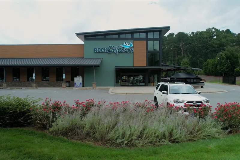 Slide: The Image of Outdoor store with a white SUV parked, featuring Barletta ARIA 22UC, 2026 model. - 11