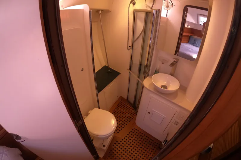 Slide: The Image of Compact bathroom in 2005 Catalina Morgan 440 yacht with shower, sink, and toilet. - 32