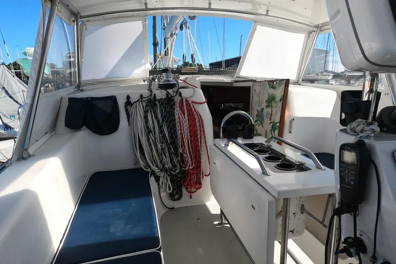 Slide: The Image of Interior view of 2005 Catalina Morgan 440 sailboat cockpit with ropes and seating. - 9