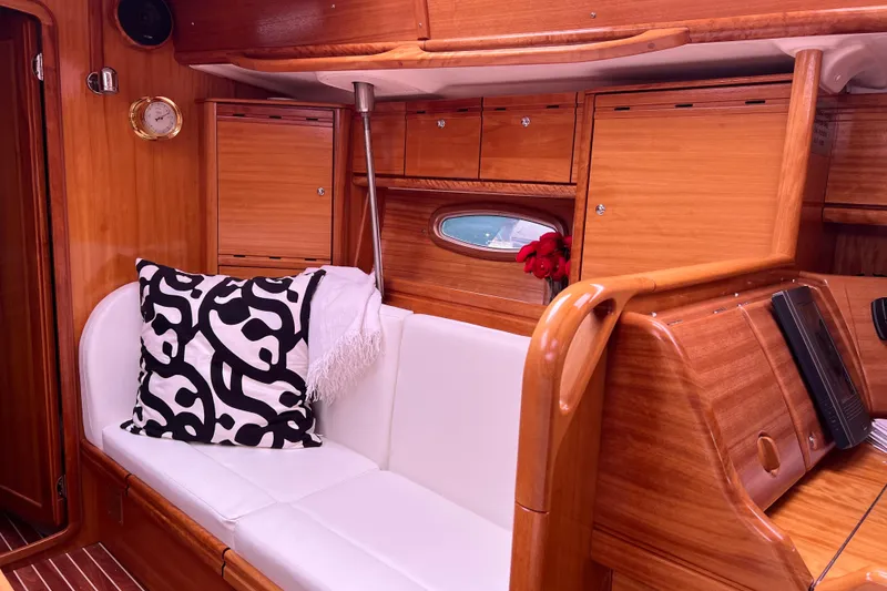 Slide: The Image of Interior of 2008 Bavaria 40 Vision yacht with wooden cabinetry and white seating. - 12