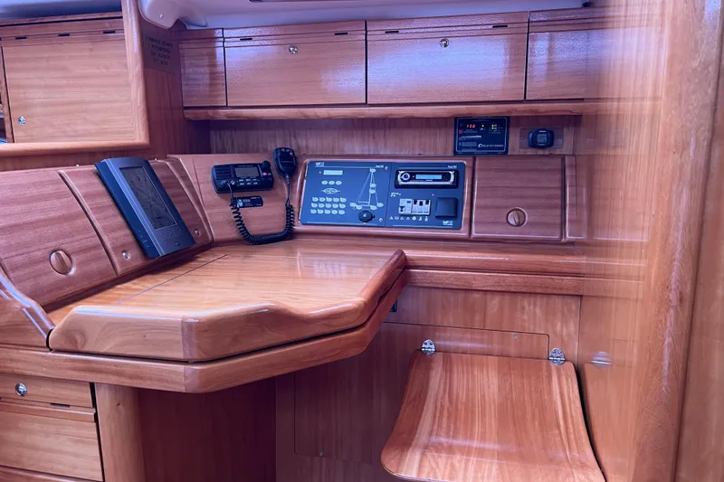 Slide: The Image of Interior of 2008 Bavaria 40 Vision yacht with navigation equipment and wooden cabinetry. - 13