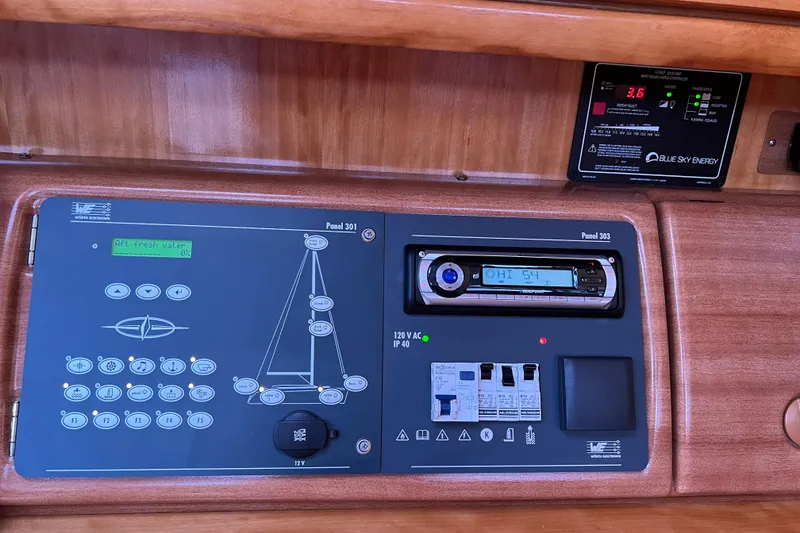 Slide: The Image of Control panel of a 2008 Bavaria 40 Vision yacht with electronic displays and switches. - 14