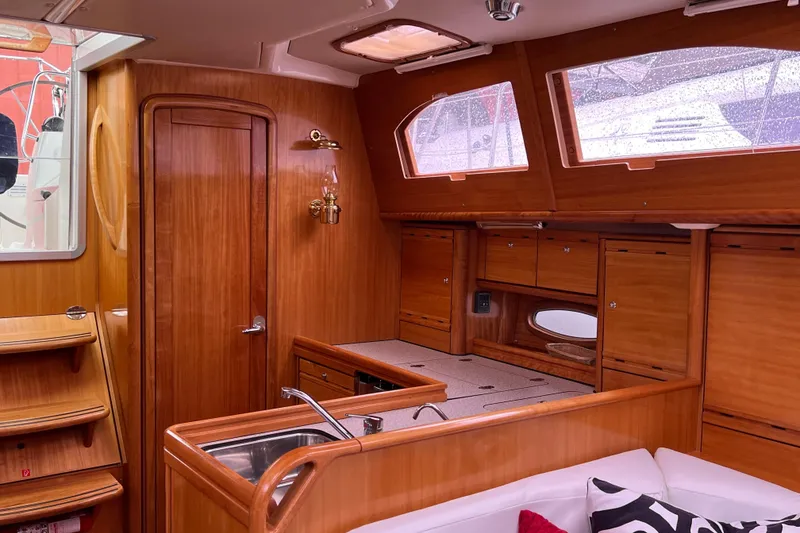 Slide: The Image of Interior of 2008 Bavaria 40 Vision yacht with wooden cabinetry and modern amenities. - 21