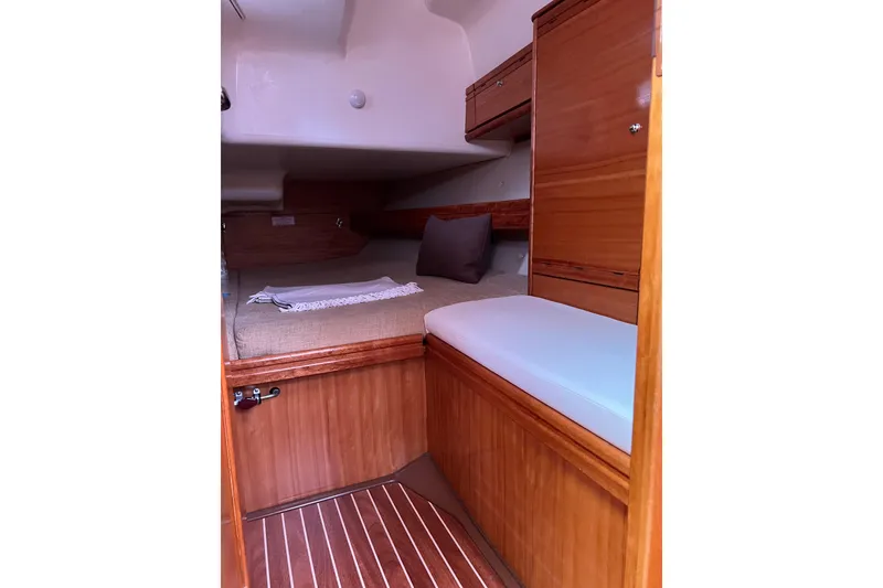 Slide: The Image of Cozy cabin interior of 2008 Bavaria 40 Vision yacht with wooden finish and comfortable bedding. - 27