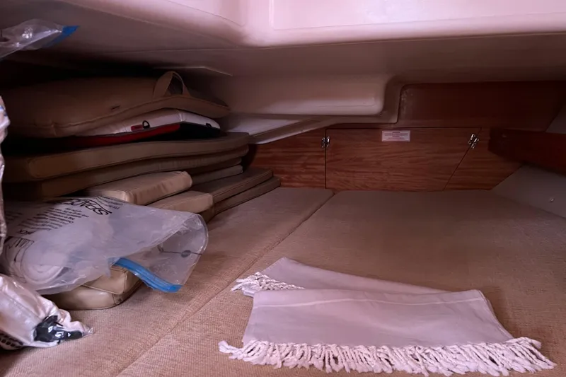 Slide: The Image of Interior cabin storage of 2008 Bavaria 40 Vision yacht with cushions and a white cloth. - 28