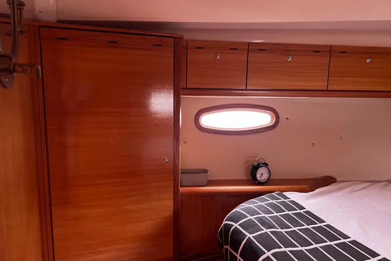 Slide: The Image of Interior of 2008 Bavaria 40 Vision yacht cabin with wooden cabinets and cozy bed. - 31