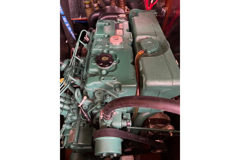 Slide: The Image of Engine of a 2008 Bavaria 40 Vision sailboat, showcasing intricate mechanical details. - 37
