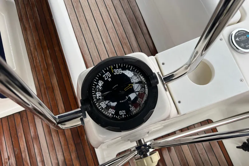 Slide: The Image of Compass on Bavaria 40 Vision yacht, 2008 model, with wooden deck background. - 5