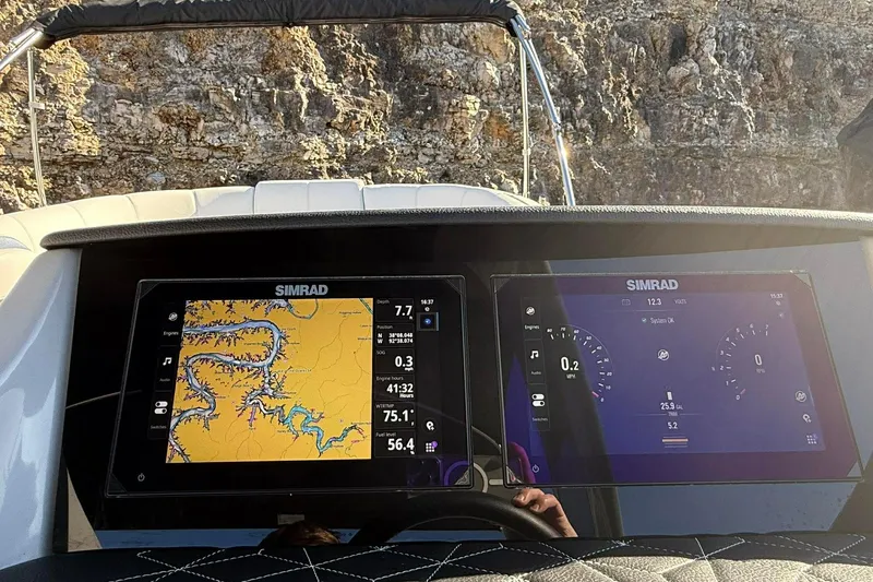 Slide: The Image of Simrad navigation screens on 2024 Harris Grand Mariner 250 boat dashboard. - 12