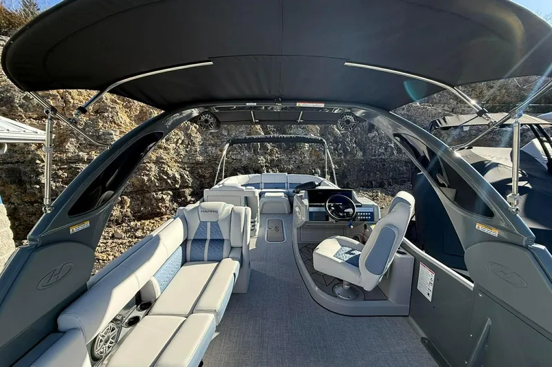 Slide: The Image of 2024 Harris Grand Mariner 250 boat interior with luxurious seating and modern helm. - 3