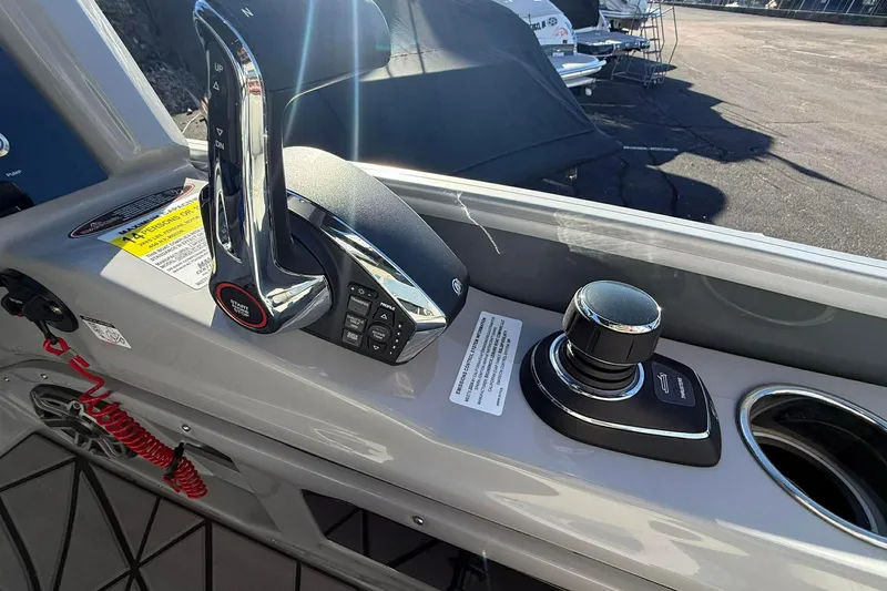 Slide: The Image of 2024 Harris Grand Mariner 250 boat controls with joystick and throttle lever. - 6
