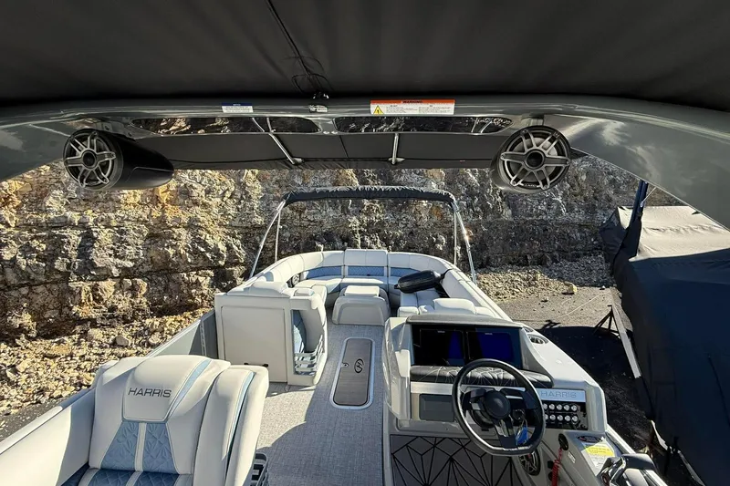 Slide: The Image of 2024 Harris Grand Mariner 250 boat interior with modern helm and seating. - 7