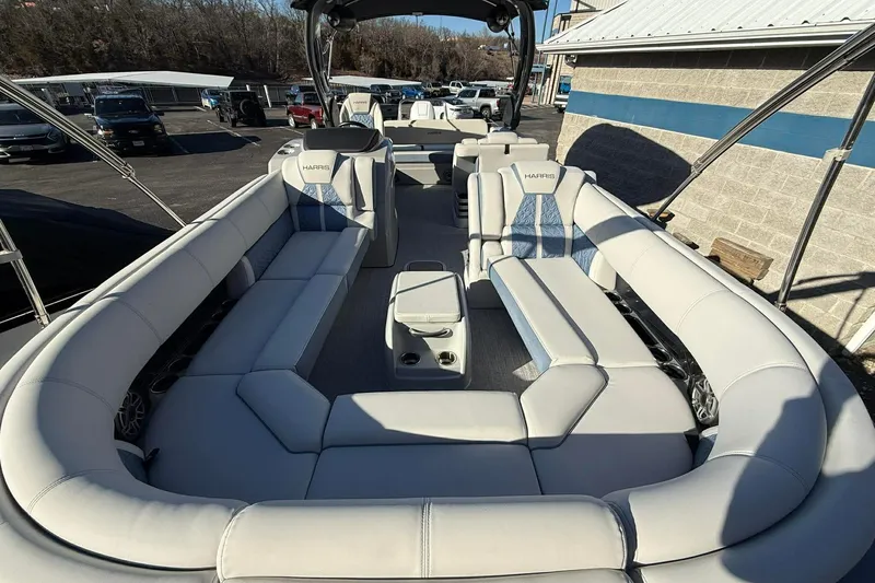 Slide: The Image of 2024 Harris Grand Mariner 250 pontoon boat with luxurious seating and modern design. - 9