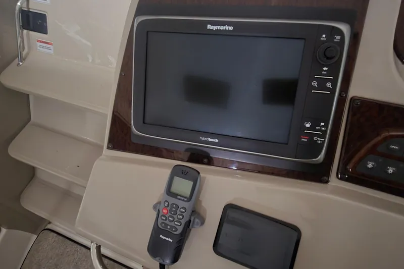 Slide: The Image of Control panel of a 2009 Sea Ray Sundancer 350 with Raymarine display and remote. - 11