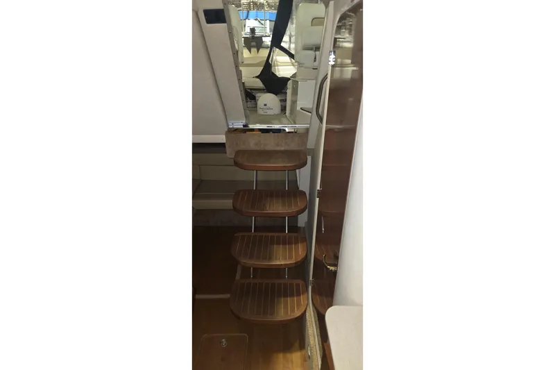 Slide: The Image of Interior stairs of 2009 Sea Ray Sundancer 350 yacht, featuring wooden steps and modern design. - 20