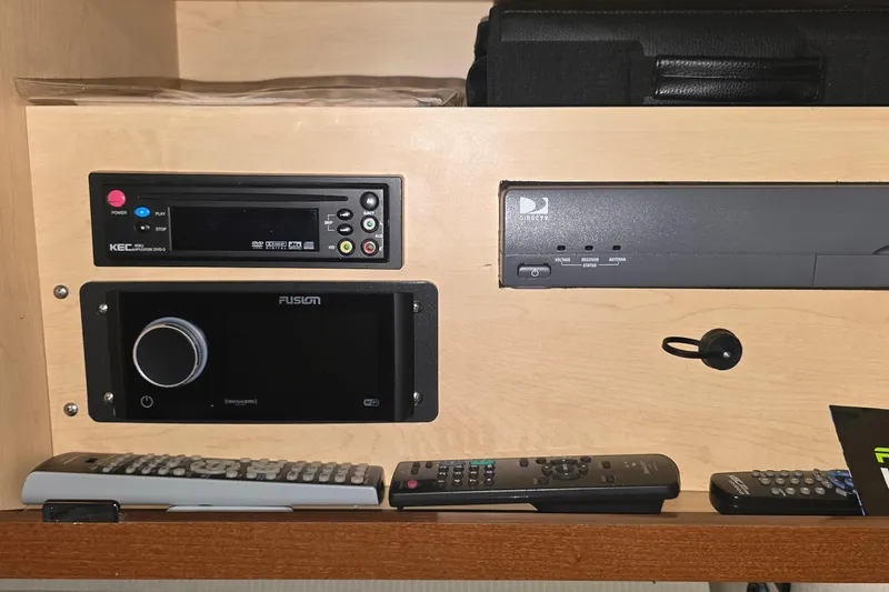 Slide: The Image of Entertainment system with remotes in a 2009 Sea Ray Sundancer 350 yacht. - 25