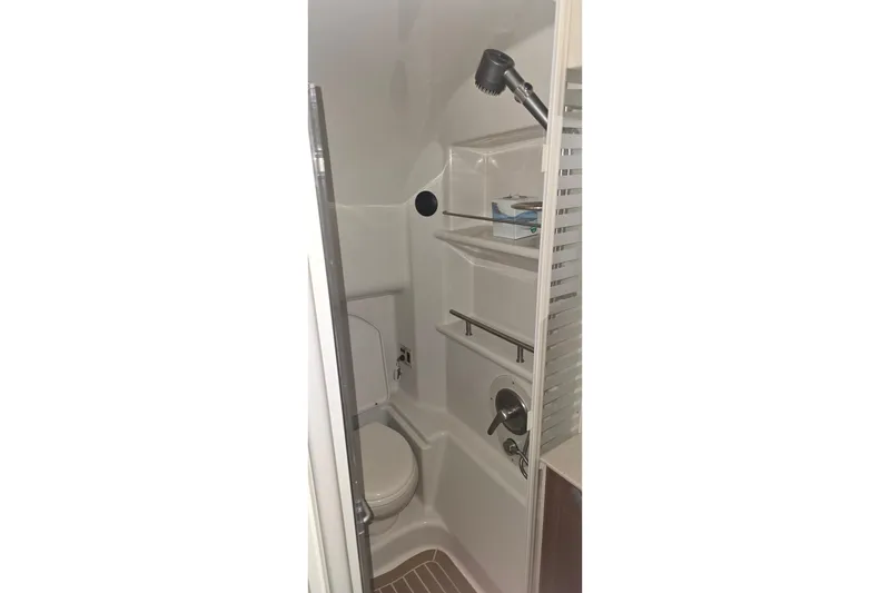 Slide: The Image of Bathroom interior of 2009 Sea Ray Sundancer 350 yacht, featuring shower and toilet. - 27