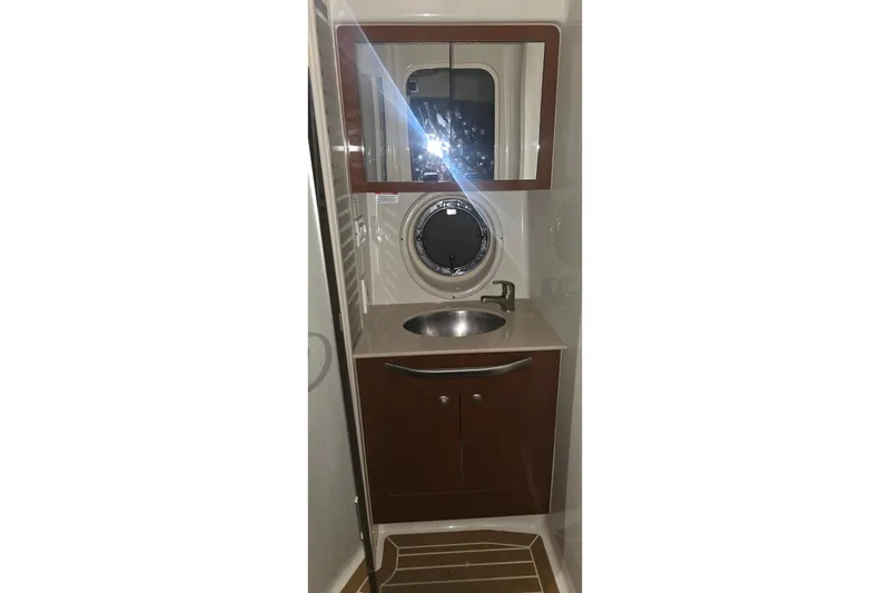 Slide: The Image of Bathroom interior of 2009 Sea Ray Sundancer 350 yacht with sink and mirror. - 28