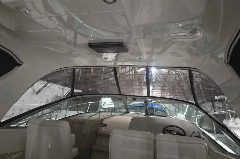 Slide: The Image of Interior view of 2009 Sea Ray Sundancer 350 yacht, featuring helm and seating area. - 7