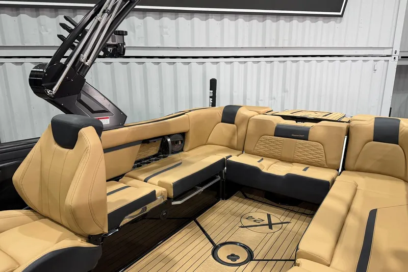 Slide: The Image of 2023 MasterCraft X24 boat interior with luxurious tan seating and sleek design. - 11