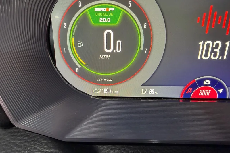 Slide: The Image of 2023 MasterCraft X24 dashboard display showing speed, fuel, and surf settings. - 13