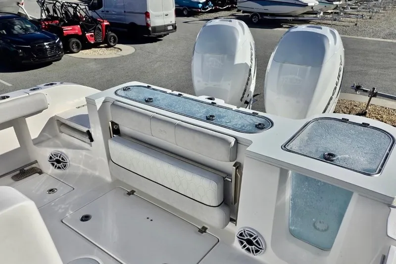 Slide: The Image of 2023 Sea Fox 328 Commander boat interior with dual engines and seating area. - 10