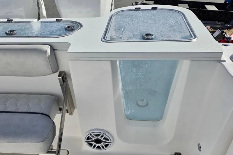 Slide: The Image of 2023 Sea Fox 328 Commander boat interior with seating and storage compartments. - 18
