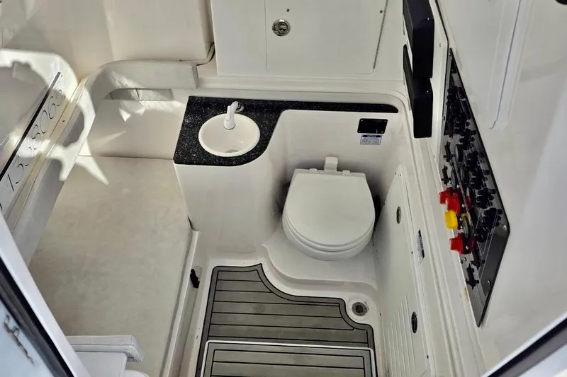 Slide: The Image of 2023 Sea Fox 328 Commander boat interior with toilet and control panel. - 6
