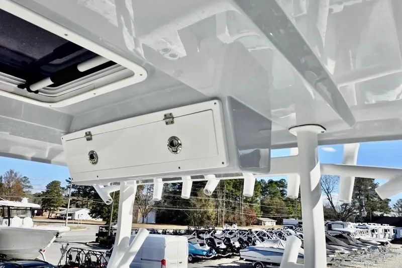 Slide: The Image of 2023 Sea Fox 328 Commander boat interior with storage compartment and rod holders. - 7