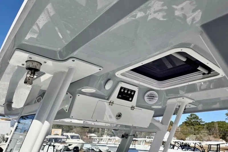 Slide: The Image of 2023 Sea Fox 328 Commander boat interior with control panel and hatch. - 8