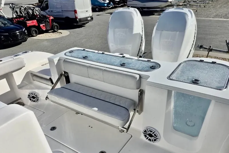 Slide: The Image of 2023 Sea Fox 328 Commander boat interior with seating and triple outboard engines. - 9