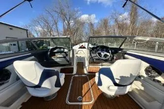 Slide: The Image of 2014 Monterey 204FS boat interior with dual steering wheels and white seats. - 8