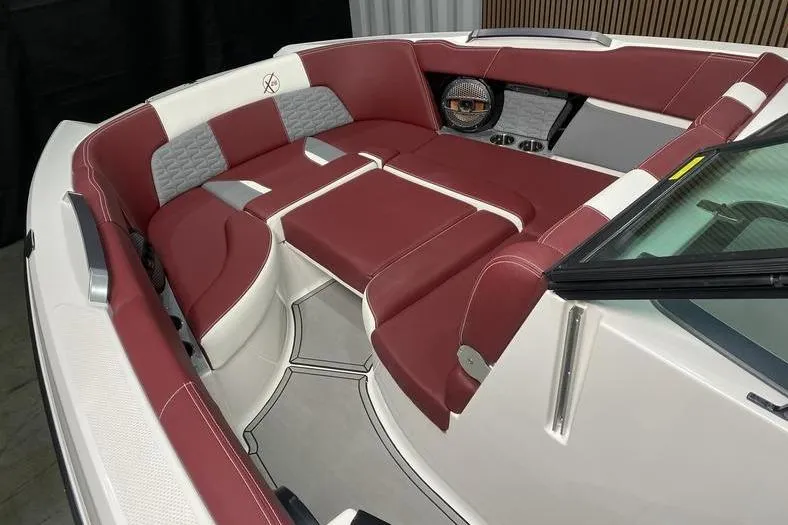 Slide: The Image of 2023 MasterCraft X26 boat interior with red and white seating, modern design. - 10