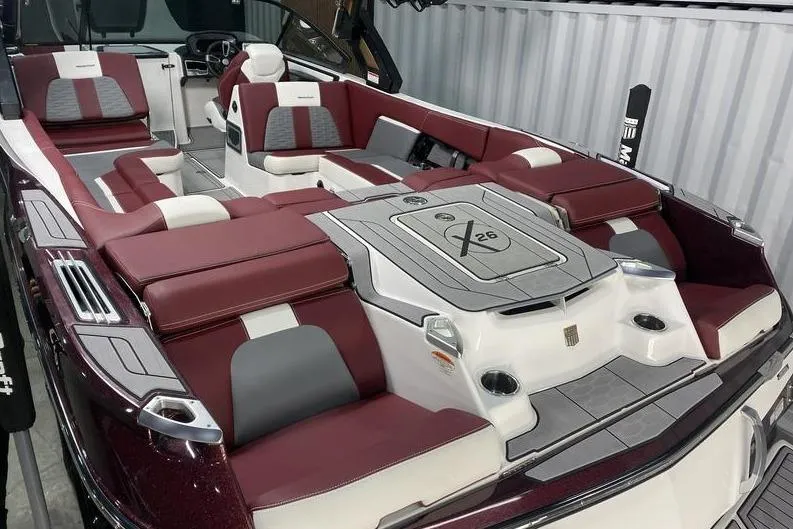 Slide: The Image of 2023 MasterCraft X26 boat interior with luxurious seating and modern design. - 4
